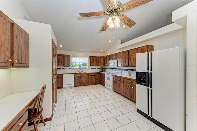 kitchen featuring white appliances, vaulted ceiling, ceiling fan, sink, and light tile patterned flooring