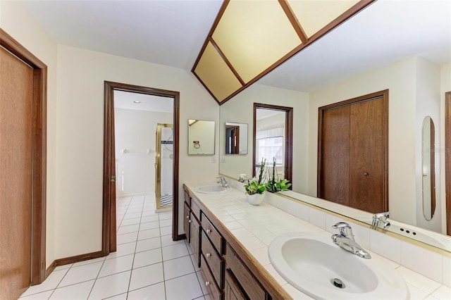 bathroom with tile patterned floors and vanity