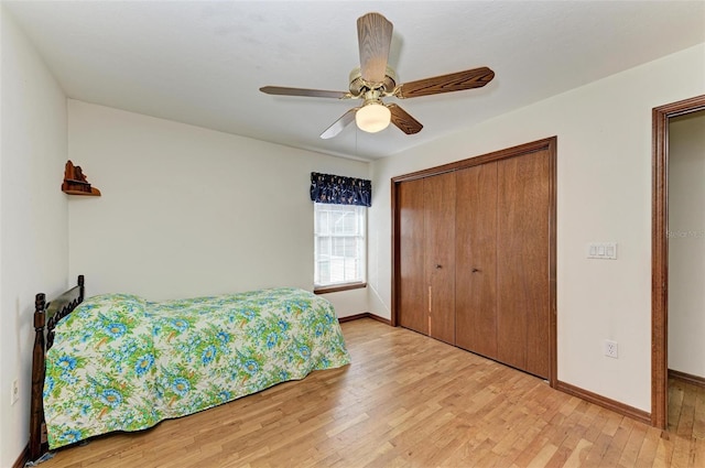 bedroom featuring a closet, light hardwood / wood-style flooring, and ceiling fan