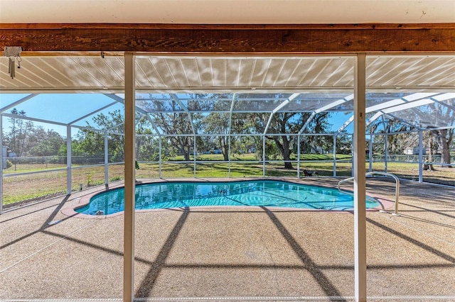 view of swimming pool featuring a lanai and a patio