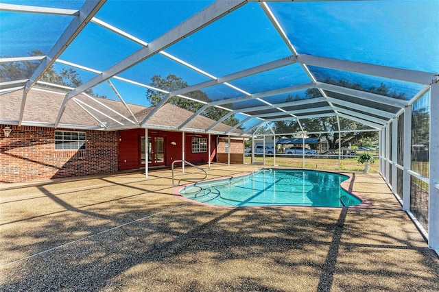 view of pool featuring a patio and a lanai