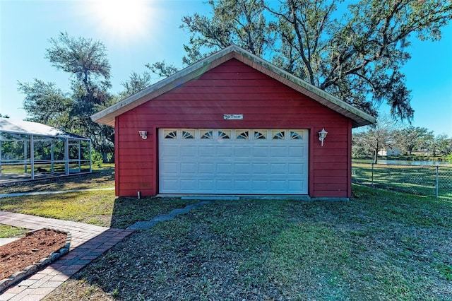 garage with a yard