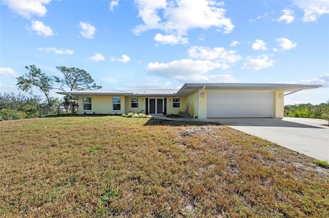 ranch-style home featuring concrete driveway, an attached garage, a front lawn, and stucco siding