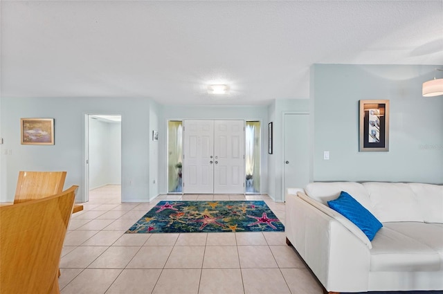 entryway featuring a textured ceiling and light tile patterned floors