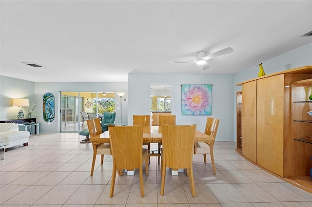 dining area featuring visible vents, ceiling fan, and light tile patterned floors