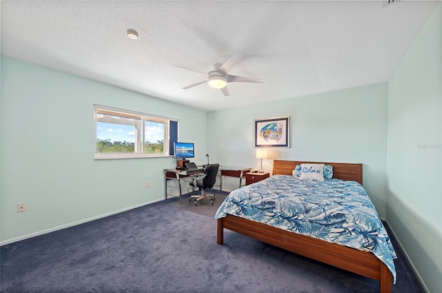 bedroom featuring ceiling fan, baseboards, dark colored carpet, and a textured ceiling