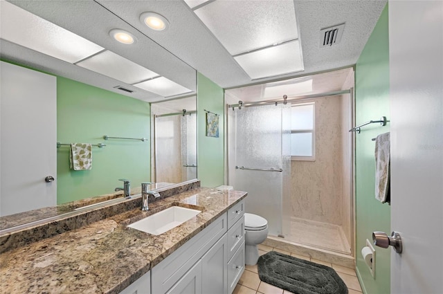 bathroom with a shower stall, visible vents, and tile patterned flooring