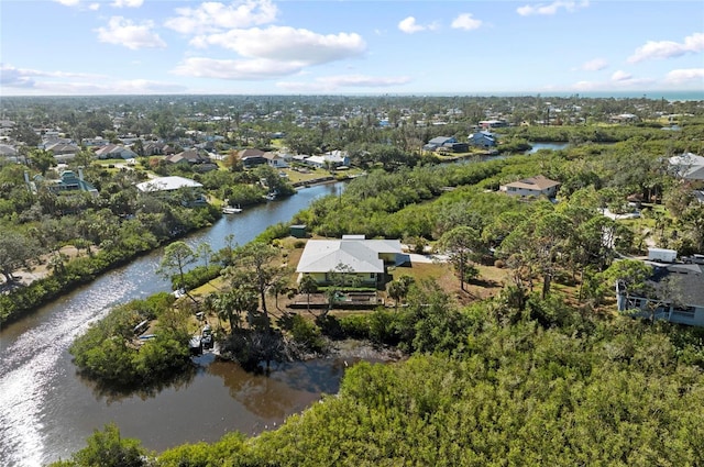 drone / aerial view with a water view and a residential view