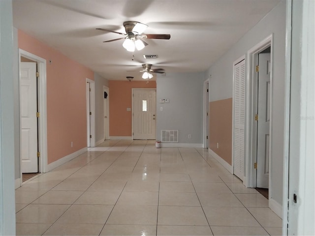 corridor with light tile patterned floors