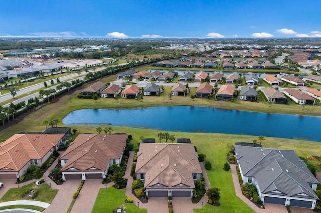 birds eye view of property with a water view