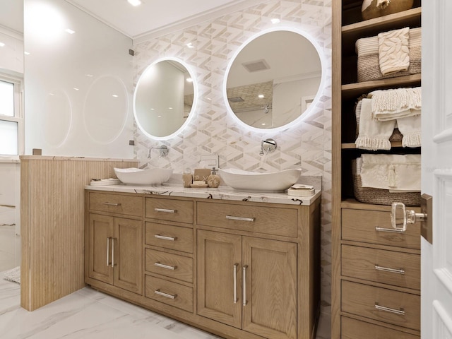 bathroom with vanity and crown molding