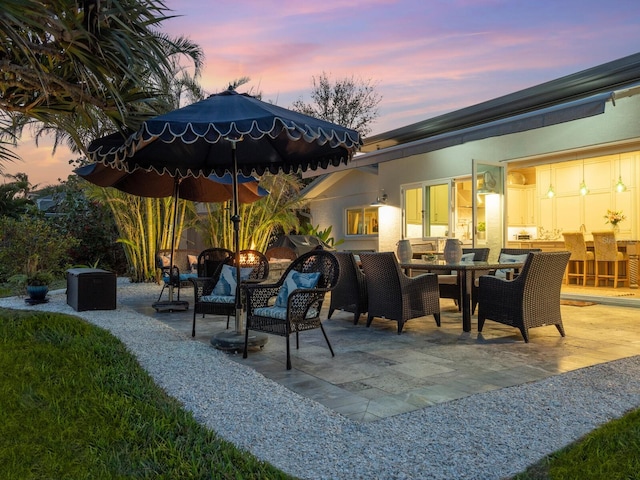 view of patio terrace at dusk