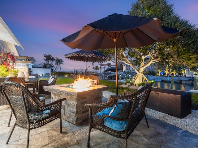 patio terrace at dusk with an outdoor fire pit