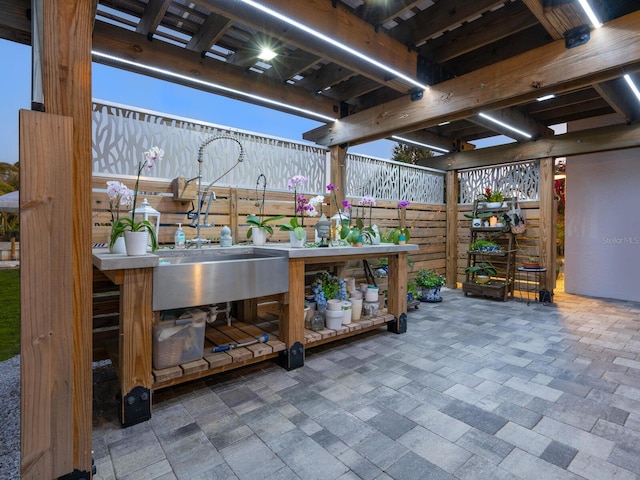 view of patio / terrace featuring a wet bar