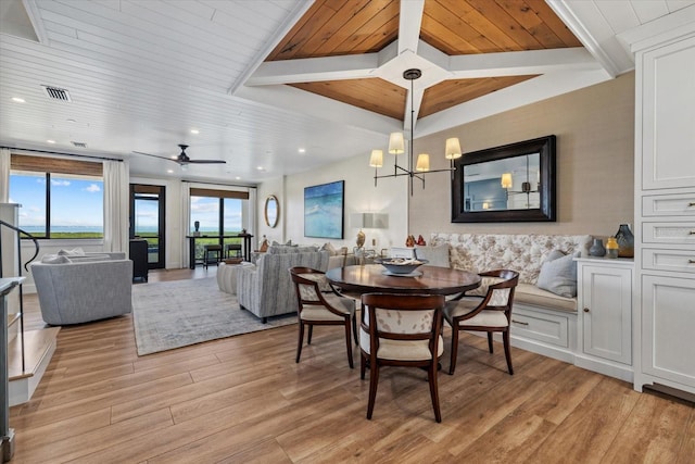 dining area with light wood-type flooring and ceiling fan with notable chandelier