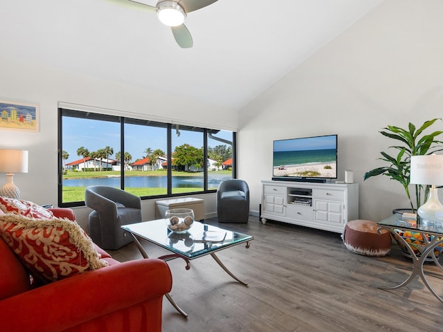 living room with ceiling fan, dark hardwood / wood-style flooring, and high vaulted ceiling