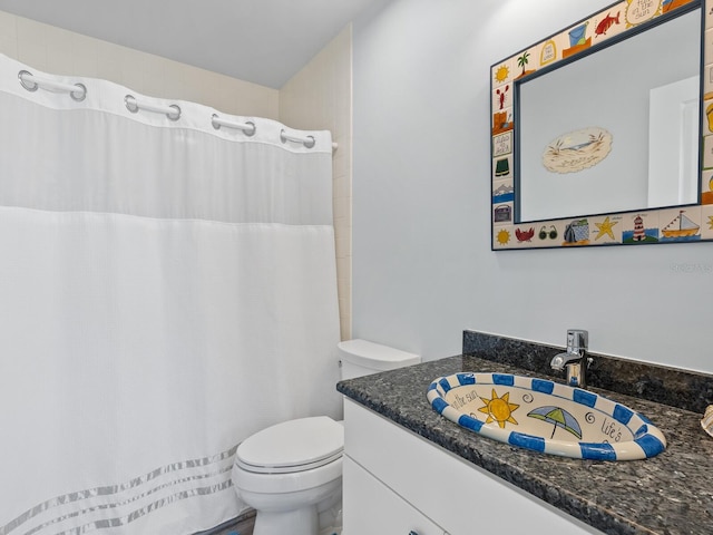 bathroom with toilet and vanity