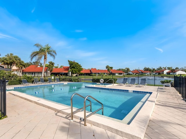 view of swimming pool featuring a patio