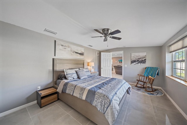 tiled bedroom featuring ceiling fan and lofted ceiling