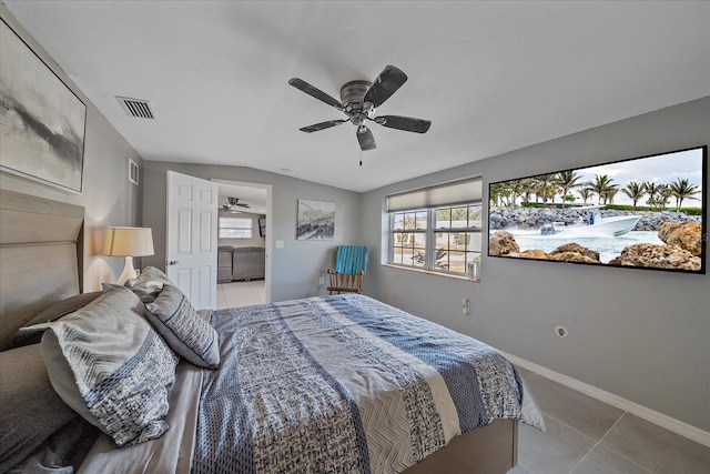 tiled bedroom with ceiling fan and ensuite bathroom