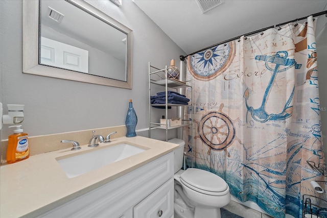 bathroom featuring a shower with shower curtain, vanity, and toilet