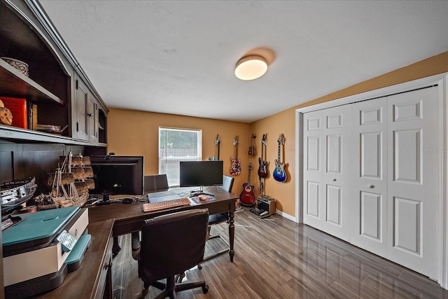 office space with dark hardwood / wood-style flooring and a textured ceiling