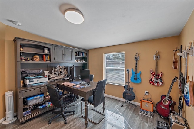 home office with wood-type flooring