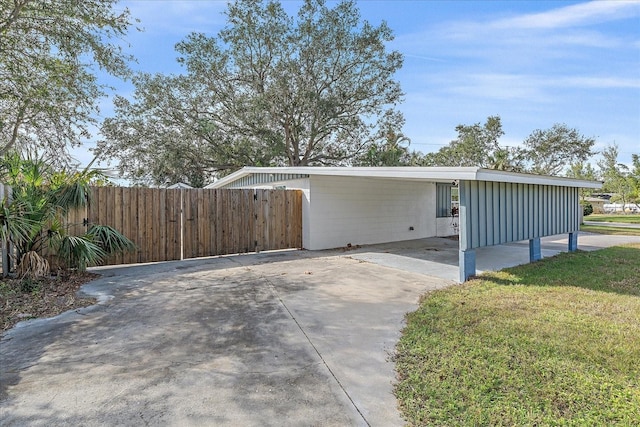 view of side of home with a yard