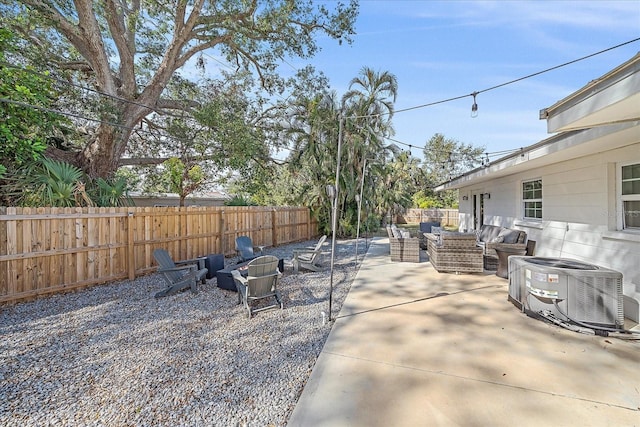 view of patio featuring outdoor lounge area and cooling unit