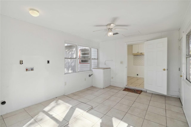 clothes washing area featuring washer hookup, hookup for an electric dryer, and light tile patterned floors