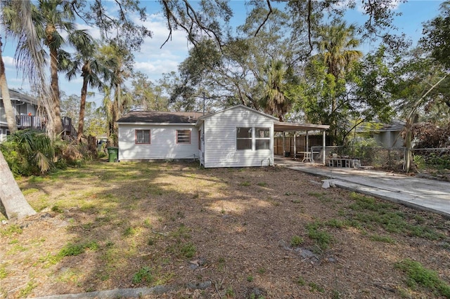 rear view of house with a carport