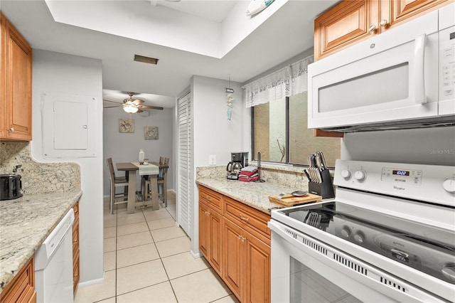 kitchen featuring white appliances, light stone countertops, light tile patterned floors, ceiling fan, and tasteful backsplash