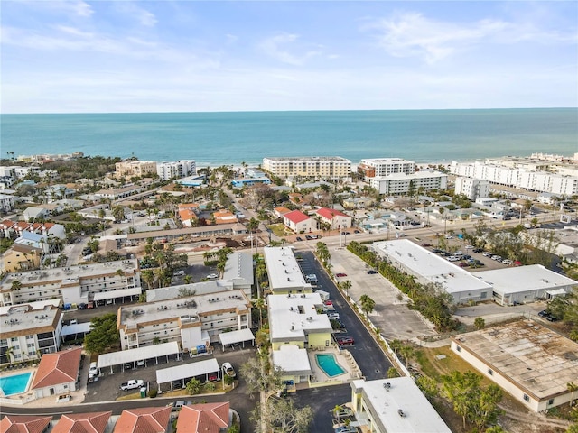 birds eye view of property featuring a view of city and a water view