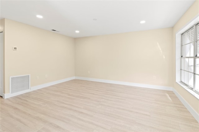 unfurnished room featuring light wood-type flooring