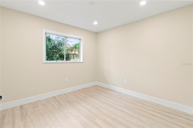 spare room featuring light hardwood / wood-style floors