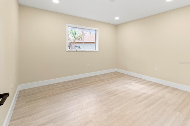 spare room featuring light hardwood / wood-style flooring