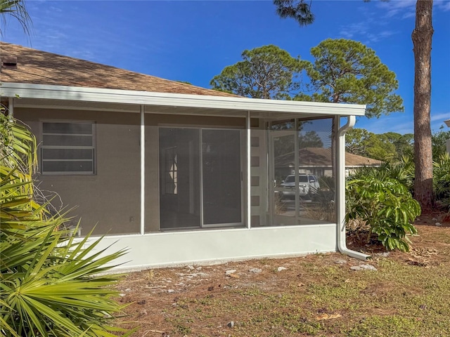 back of house with a sunroom