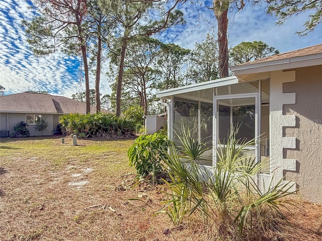 view of yard featuring a sunroom