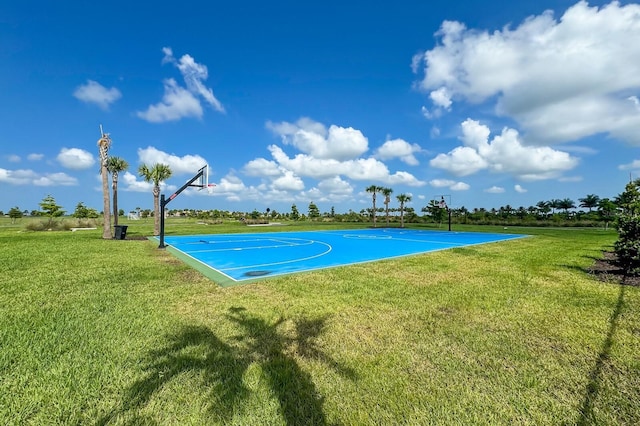 view of basketball court featuring a lawn