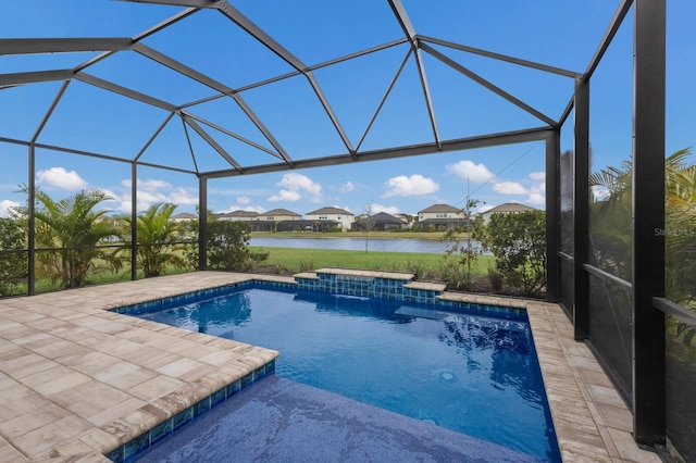 view of swimming pool with a water view, pool water feature, a patio area, and glass enclosure