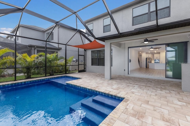 view of pool featuring a lanai, a patio, and ceiling fan