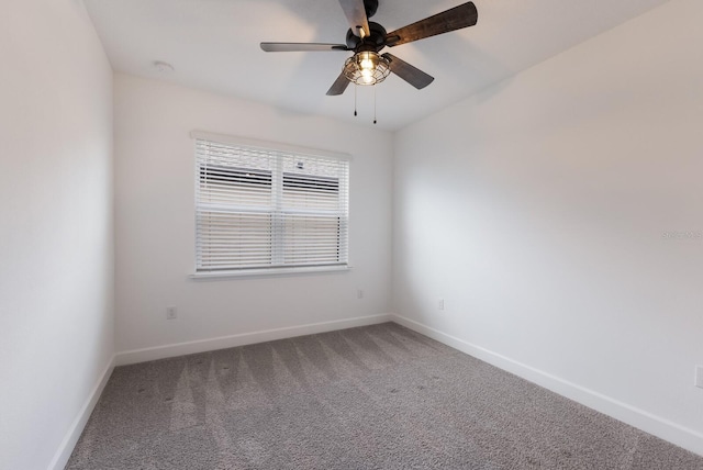 unfurnished room featuring ceiling fan and carpet floors