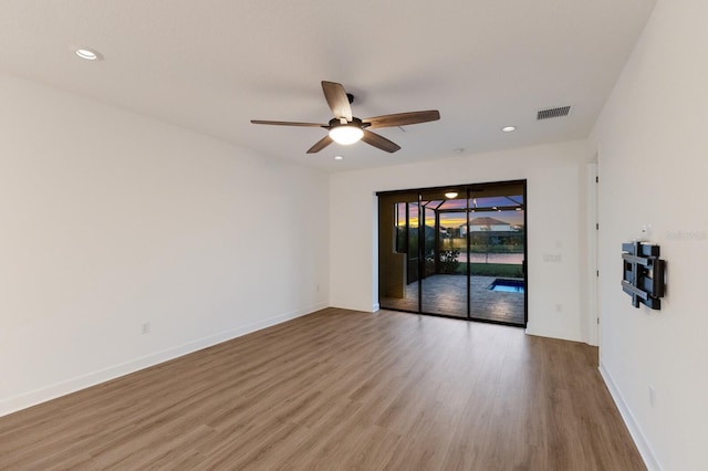 spare room with ceiling fan and light hardwood / wood-style floors