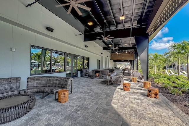 view of patio with outdoor lounge area and ceiling fan