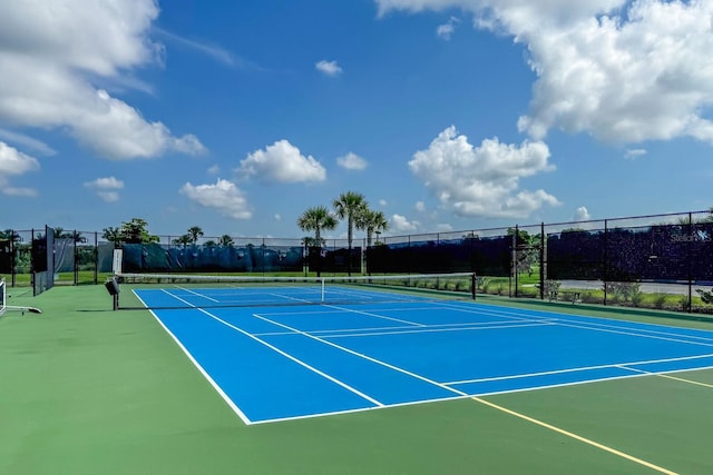 view of tennis court featuring basketball court