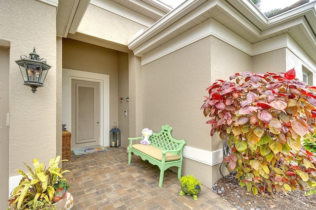 entrance to property featuring a patio area