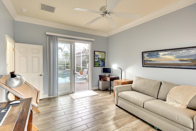 living room featuring crown molding and ceiling fan