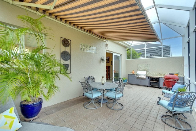 view of patio featuring exterior kitchen, a lanai, and area for grilling