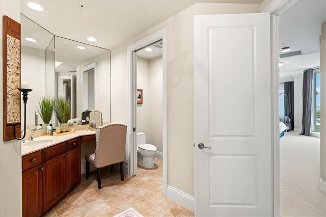 bathroom with vanity and toilet