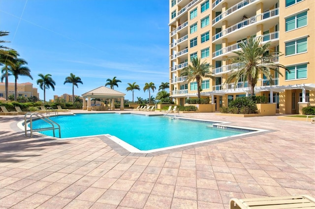 view of pool featuring a gazebo and a patio area